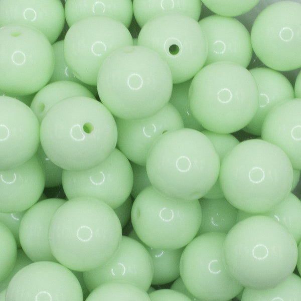 close up view of a pile of 16mm Mint Green Solid Acrylic Bubblegum Jewelry Beads