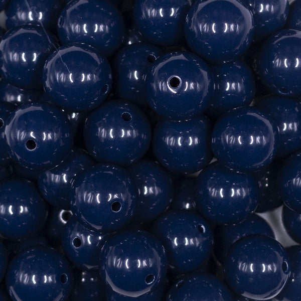 Close up view of a pile of 16mm Navy Blue Solid Acrylic Bubblegum Jewelry Beads
