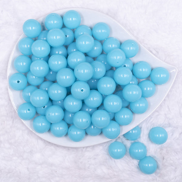 Top view of a pile of 16mm Blue Neon Solid Acrylic Bubblegum Jewelry Beads