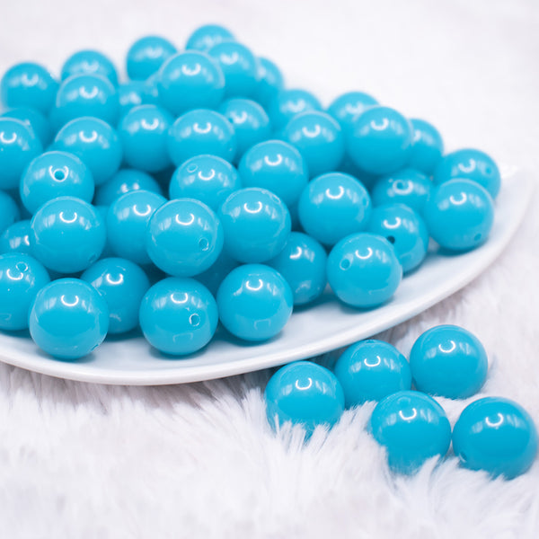 front view of a pile of 16mm Neon Blue Solid Bubblegum Beads