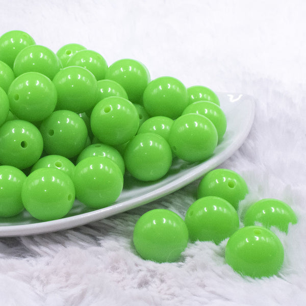 front view of a pile of 16mm Neon Green Solid Acrylic Bubblegum Jewelry Beads
