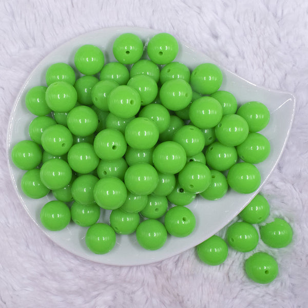 top view of a pile of 16mm Neon Green Solid Acrylic Bubblegum Jewelry Beads