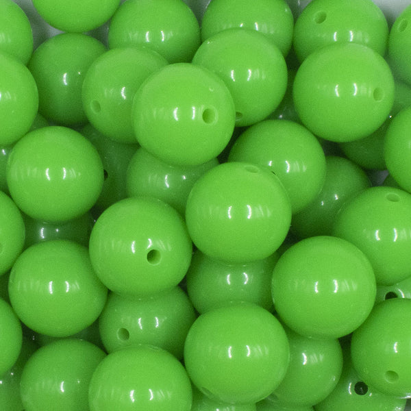 close up view of a pile of 16mm Neon Green Solid Acrylic Bubblegum Jewelry Beads