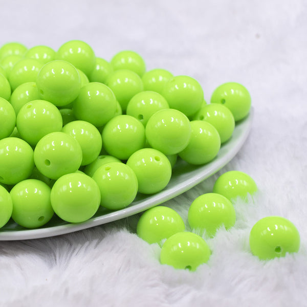 Front view of a pile of 116mm Neon Lime Solid Acrylic Bubblegum Jewelry Beads