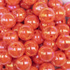 close up view of a pile of  16mm Neon Orange Solid AB Bubblegum Beads