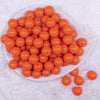 Top view of a pile of  16mm Neon Orange Solid Acrylic Bubblegum Jewelry Beads