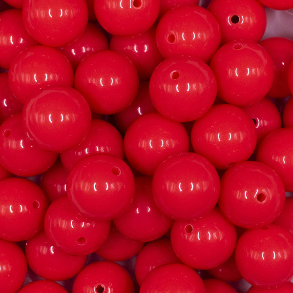 Close up view of a pile of 16mm Neon Pink Solid Acrylic Bubblegum Jewelry Beads