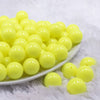 front view of a pile of 16mm Neon Yellow Solid Acrylic Bubblegum Jewelry Beads
