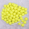 top view of a pile of 16mm Neon Yellow Solid Acrylic Bubblegum Jewelry Beads