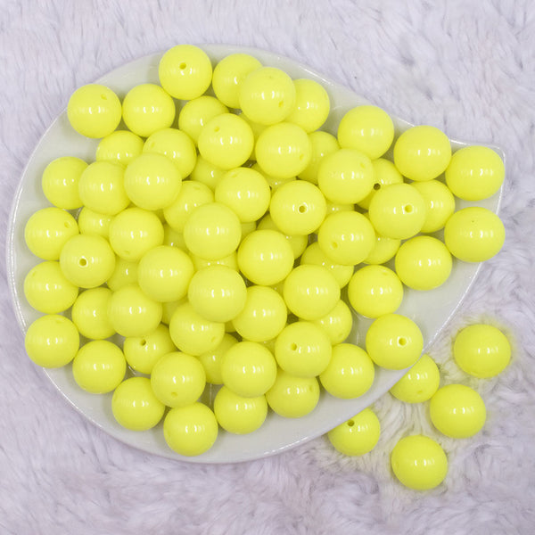 top view of a pile of 16mm Neon Yellow Solid Acrylic Bubblegum Jewelry Beads
