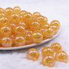 front view of a pile of 16mm Orange Crackle AB Bubblegum Beads