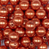 Close up view of a pile of 16mm Orange Faux Pearl Acrylic Bubblegum Jewelry Beads