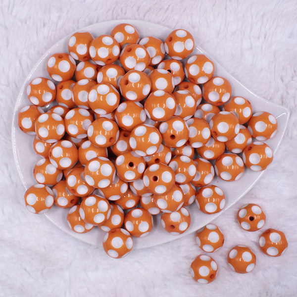 top view of a pile of 16mm Orange with White Polka Dots Bubblegum Beads