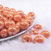front view of a pile of 16mm Orange Solid AB Bubblegum Beads