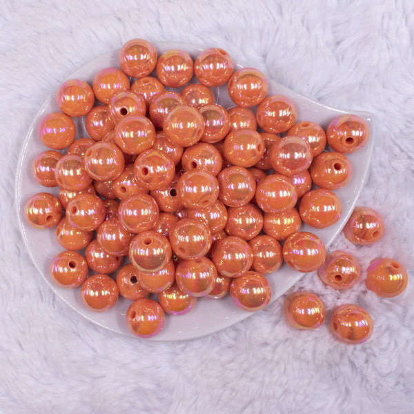 top view of a pile of 16mm Orange Solid AB Bubblegum Beads