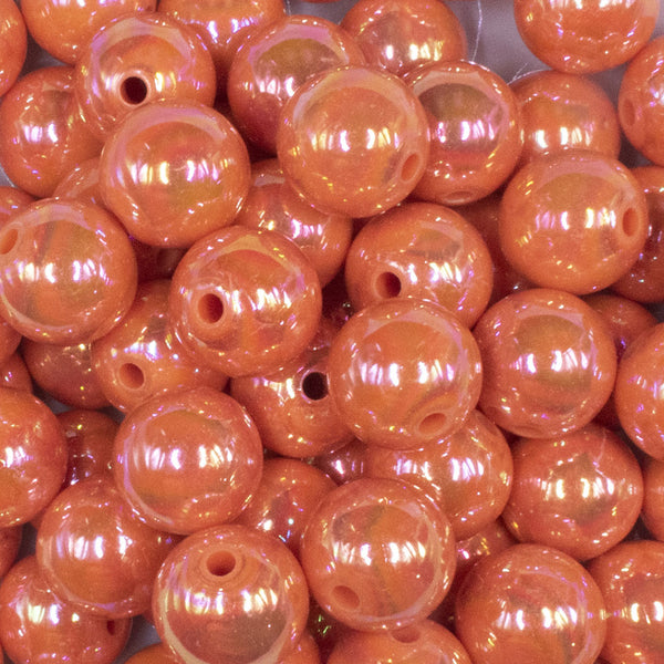 close up view of a pile of 16mm Orange Solid AB Bubblegum Beads
