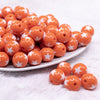 front view of a pile of 16mm Orange with White Stars Bubblegum Beads