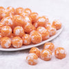 front view of a pile of 16mm Orange Tablet Acrylic Bubblegum Beads