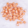 top view of a pile of 16mm Orange Tablet Acrylic Bubblegum Beads
