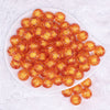 top view of a pile of 16mm Orange Transparent Pumpkin Shaped Bubblegum Beads