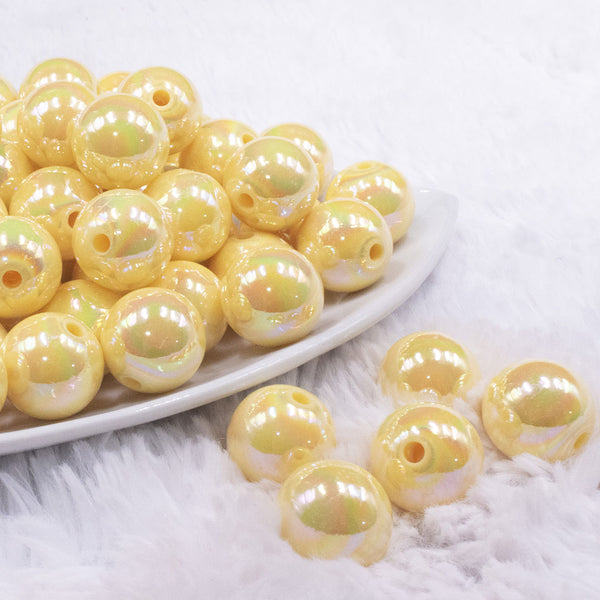 front view of a pile of 16mm Pastel Yellow Solid AB Bubblegum Beads