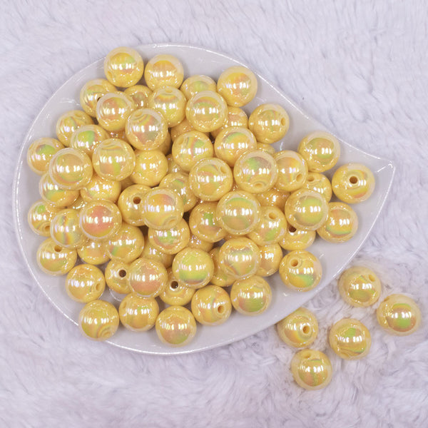 top view of a pile of 16mm Pastel Yellow Solid AB Bubblegum Beads