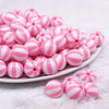 front view of a pile of 16mm Pink and White Beach Ball Bubblegum Beads