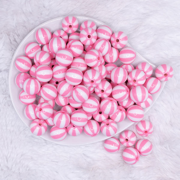 top view of a pile of 16mm Pink and White Beach Ball Bubblegum Beads
