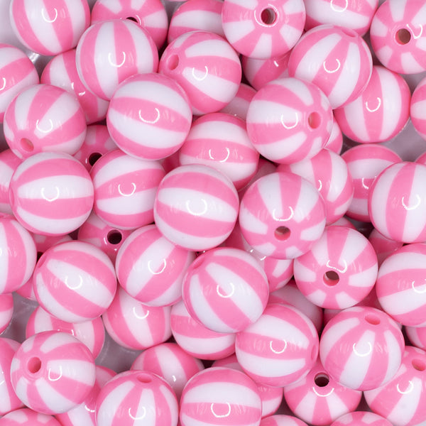 close up view of a pile of 16mm Pink and White Beach Ball Bubblegum Beads