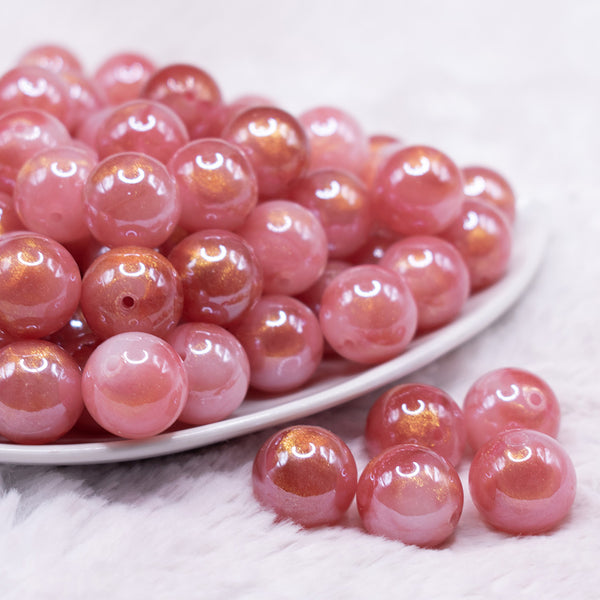 front view of a pile of 16mm Pink Galaxy Sparkle Resin Bubblegum Beads