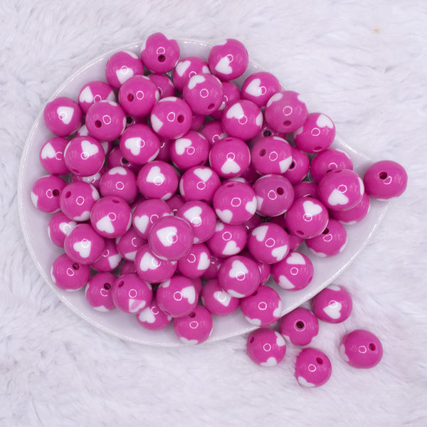 top view of a pile of 16mm Pink with White Hearts Bubblegum Beads