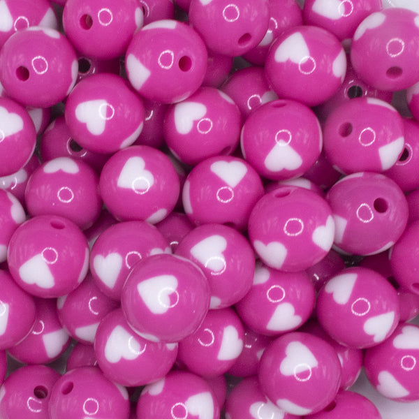close up view of a pile of 16mm Pink with White Hearts Bubblegum Beads