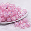 front view of a pile of 16mm Pink Majestic Confetti Bubblegum Beads