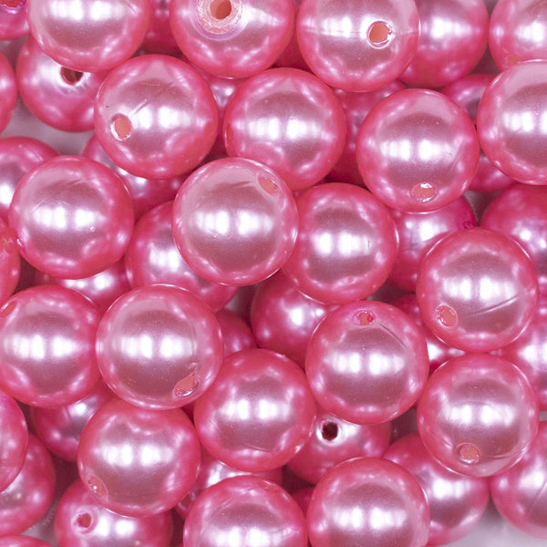 Close up view of a pile of 16mm Pink Faux Pearl Acrylic Bubblegum Jewelry Beads