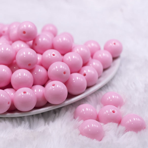 front view of a pile of 16mm Pink Solid Acrylic Bubblegum Jewelry Beads
