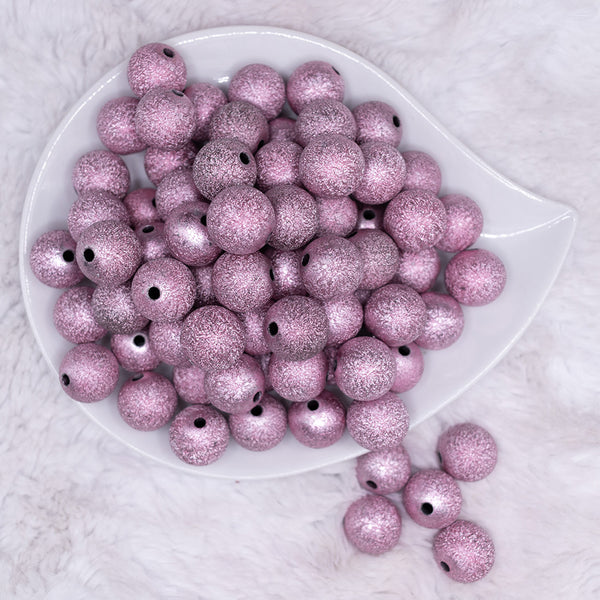 top view of a pile of 16mm Pink Stardust Acrylic Bubblegum Beads