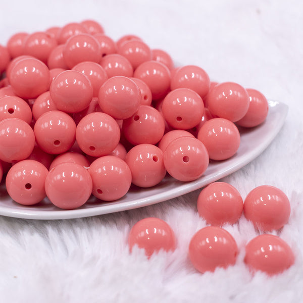 front view of a pile of 16mm Punch Pink Solid Acrylic Bubblegum Jewelry Beads