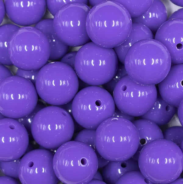 Close up view of a pile of 16mm Purple Passion Solid Acrylic Bubblegum Jewelry Beads