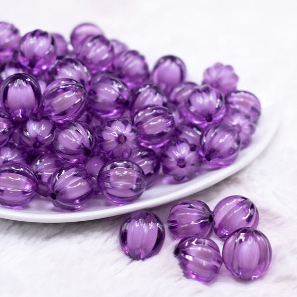 front view of a pile of 16mm Purple Transparent Pumpkin Shaped Bubblegum Beads