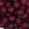 close up view of a pile of 16mm Deep Red Pumpkin 
