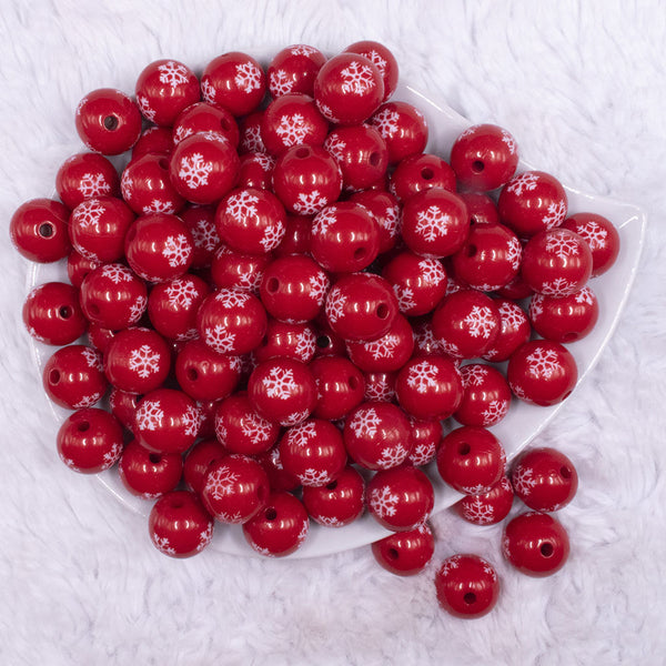 top view of a pile of 16mm Red with White Snowflake Print Acrylic Bubblegum Beads