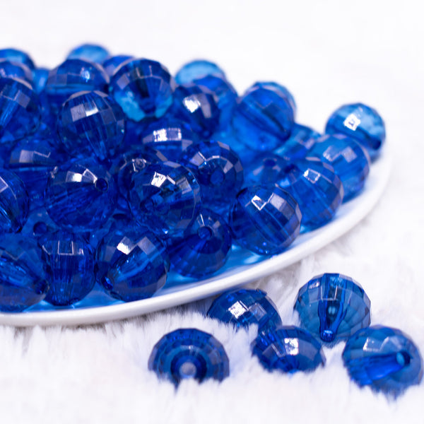 front view of a  pile of 16mm Royal Blue Transparent Disco Shaped Bubblegum Beads