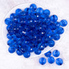 top view of a  pile of 16mm Royal Blue Transparent Disco Shaped Bubblegum Beads