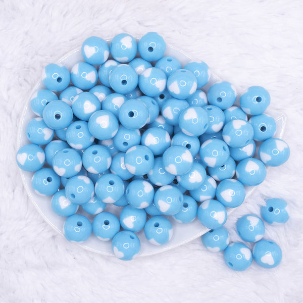 top view of a pile of 16mm Sky Blue with White Hearts Bubblegum Beads