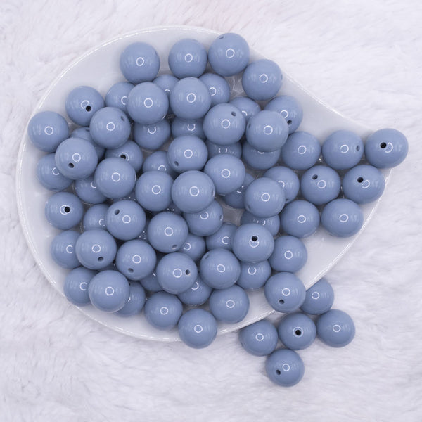 top view of a pile of 16mm Slate Blue Solid Acrylic Bubblegum Jewelry Beads
