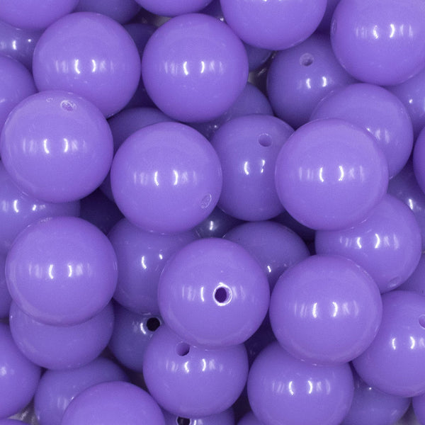 Close up view of a pile of 16mm Pretty Purple Solid Acrylic Bubblegum Jewelry Beads