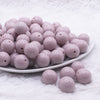 front view of a pile of 16mm Thistle Purple Solid Acrylic Bubblegum Jewelry Beads
