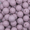 close up view of a pile of 16mm Thistle Purple Solid Acrylic Bubblegum Jewelry Beads