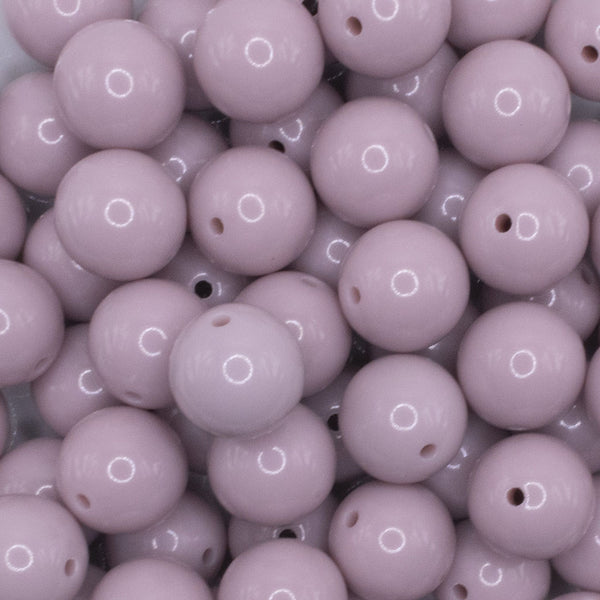 close up view of a pile of 16mm Thistle Purple Solid Acrylic Bubblegum Jewelry Beads
