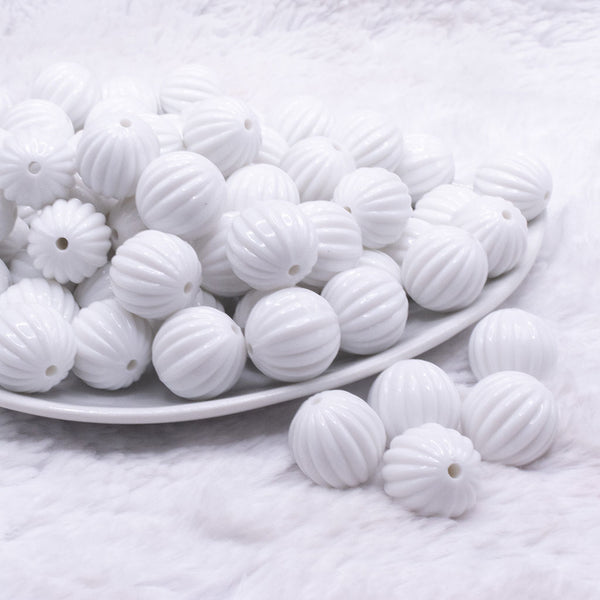 front view of a pile of 16mm White Opaque Pumpkin Shaped Bubblegum Bead